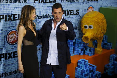 Actor Adam Sandler and his wife Jackie attend the premiere of the movie "Pixels" in New York July 18, 2015. REUTERS/Eduardo Munoz