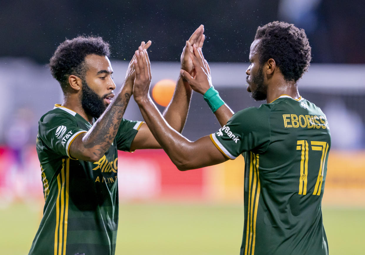 The play of Eryk Williamson (left) and Jeremy Ebobisse has helped propel the Portland Timbers into the semifinals of the MLS is Back Tournament. (Andrew Bershaw/Getty Images)