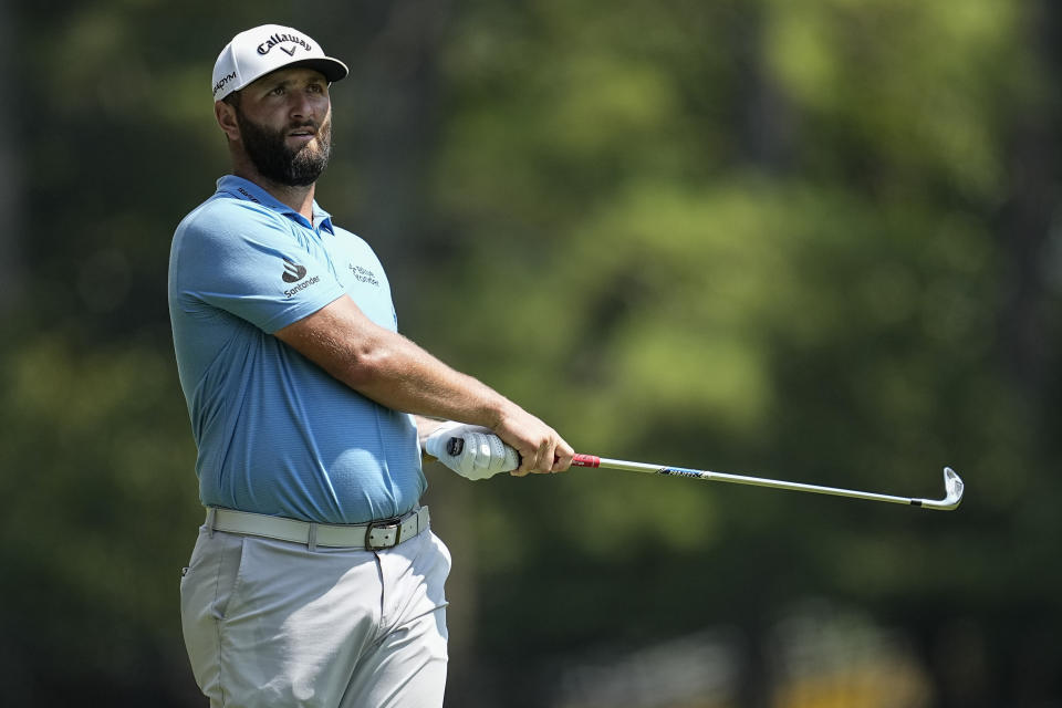 Jon Rahm hits out of the seventh fairway during the second round of the Tour Championship golf tournament, Friday, Aug. 25, 2023, in Atlanta. (AP Photo/Mike Stewart)