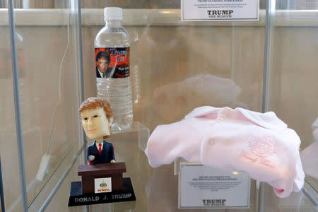 Trump Ice pure spring water, a Trump Tower onesie, and a Trump Taj Mahal bobble head are displayed at The Trump Museum near the Republican National Convention in Cleveland, Ohio, U.S., July 19, 2016. REUTERS/Lucas Jackson