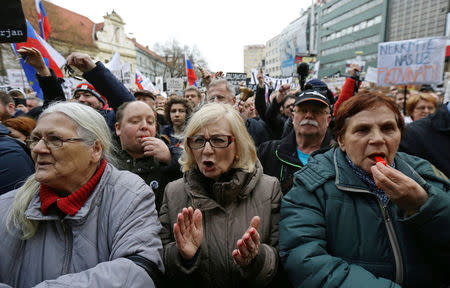 Demonstrators attend a protest rally in reaction to the murder of Slovak investigative reporter Jan Kuciak and his fiancee Martina Kusnirova, in Bratislava, Slovakia, March 16, 2018. REUTERS/David W. Cerny