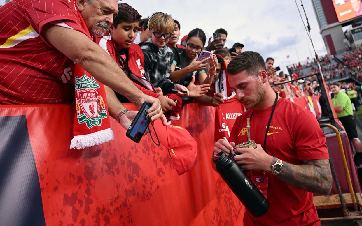 Alexis Mac Allister signs autographs