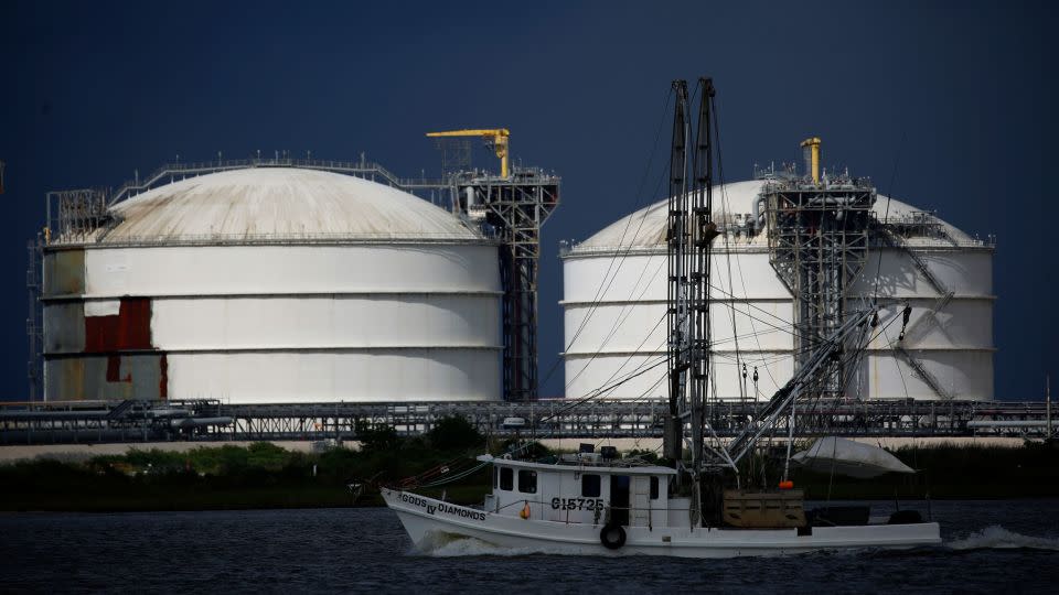 A shrimp boat passes by storage tanks at the Sabine Pass LNG Export Terminal ahead of Hurricane Laura in Sabine Pass, Texas, in August 2020. - Luke Sharrett/Bloomberg/Getty Images