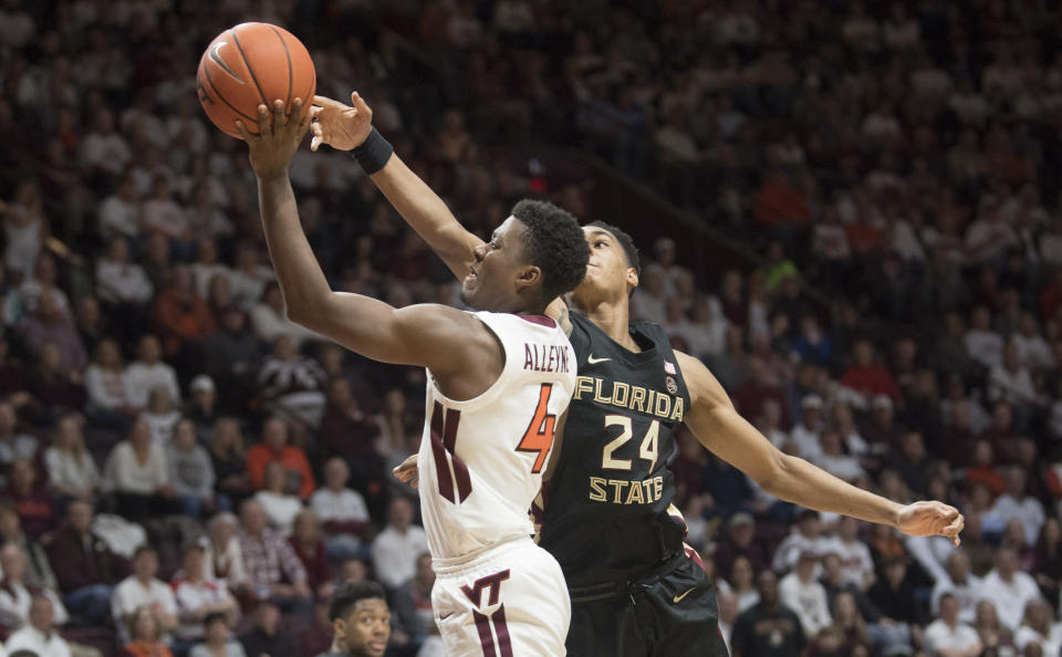 Virginia Tech guard Nahiem Alleyne (4) drives to basket as Florida State guard Devin Vassell (24) defends during the second half of an NCAA college basketball game in Blacksburg, Va., Saturday, Feb. 1, 2020. (AP Photo/Lee Luther Jr.)
