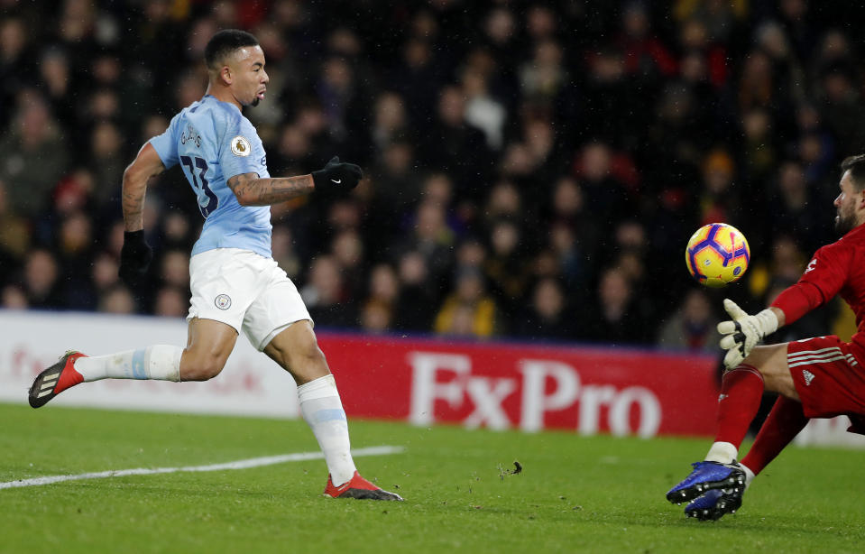 Manchester City's Gabriel Jesus, left, fails to score during the English Premier League soccer match between Watford and Manchester City at Vicarage Road stadium in Watford, England, Tuesday, Dec. 4, 2018. (AP Photo/Frank Augstein)