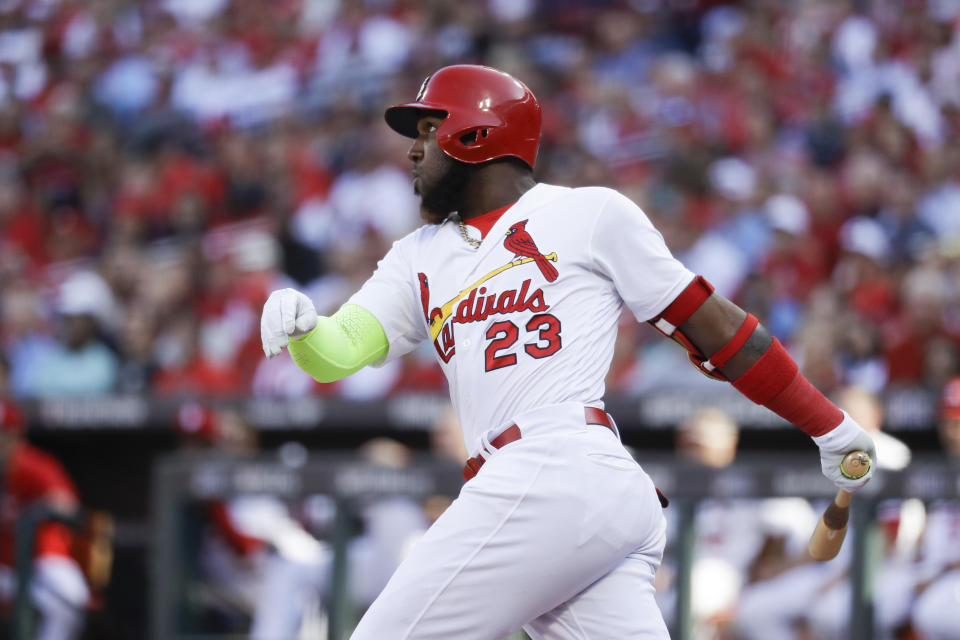 St. Louis Cardinals' Marcell Ozuna watches his solo home run during the fourth inning in Game 4 of a baseball National League Division Series against the Atlanta Braves, Monday, Oct. 7, 2019, in St. Louis. (AP Photo/Charlie Riedel)