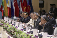 In this photo released by the ASEAN Organizing Committee, Singapore Foreign Minister Vivian Balakrishnan, second from right, speaks during a meeting by the ASEAN foreign ministers with members of the ASEAN Intergovernmental Commission on Human Rights, Wednesday, Aug. 1, 2018, in Singapore. Southeast Asian nations are expected to welcome an initial negotiating draft of a nonaggression pact with China on the South China Sea, but critics warn that the protracted talks provide a diplomatic cover for Beijing. (ASEAN Organizing Committee via AP)