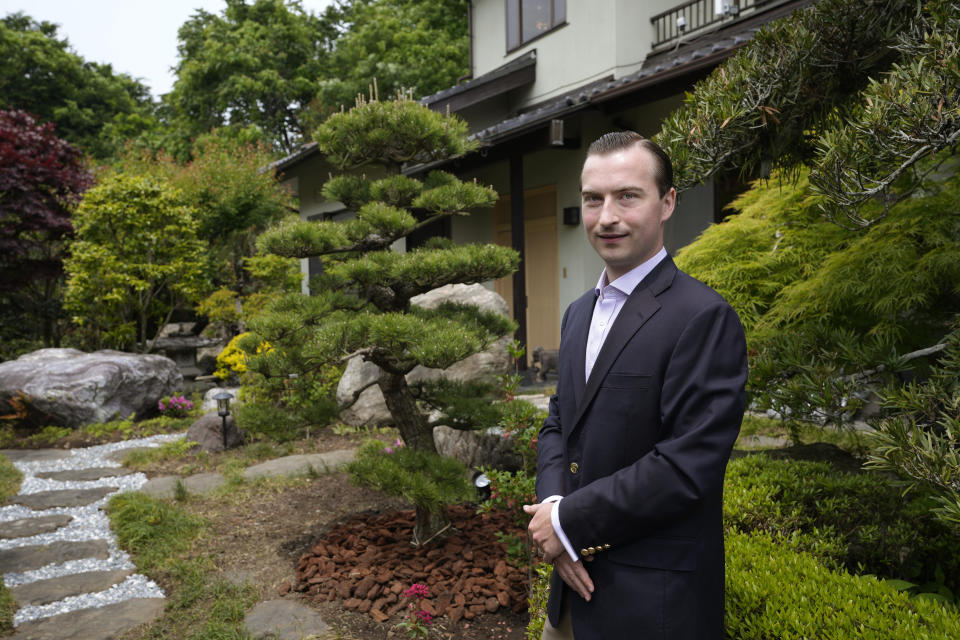 Parker J. Allen poses for a photo at a home of his mother and business partner Linda Allen before an interview with The Associated Press at Linda Allen's home in Ogawamachi, northwest of Tokyo, Friday, May 6, 2022. The Japanese yen has weakened, trading in recent weeks at 20-year lows of 130 yen to the U.S. dollar just when prices of oil and other goods are surging due to the war in Ukraine, and that's a mixed blessing. The news on the weakening yen hasn’t been all bad for some including Allen. Interest is picking up, said Allen, who runs a business finding bargain-priced homes in the Japanese countryside and suburban Tokyo for foreign buyers looking for a second home or office. (AP Photo/Hiro Komae)