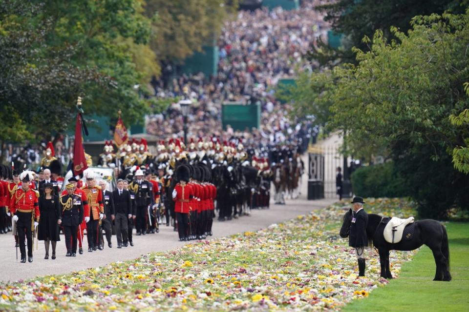 Emma, the monarch’s fell pony, stands as the Queen’s coffin arrives at Windsor Castle (Andrew Matthews/PA) (PA Wire)