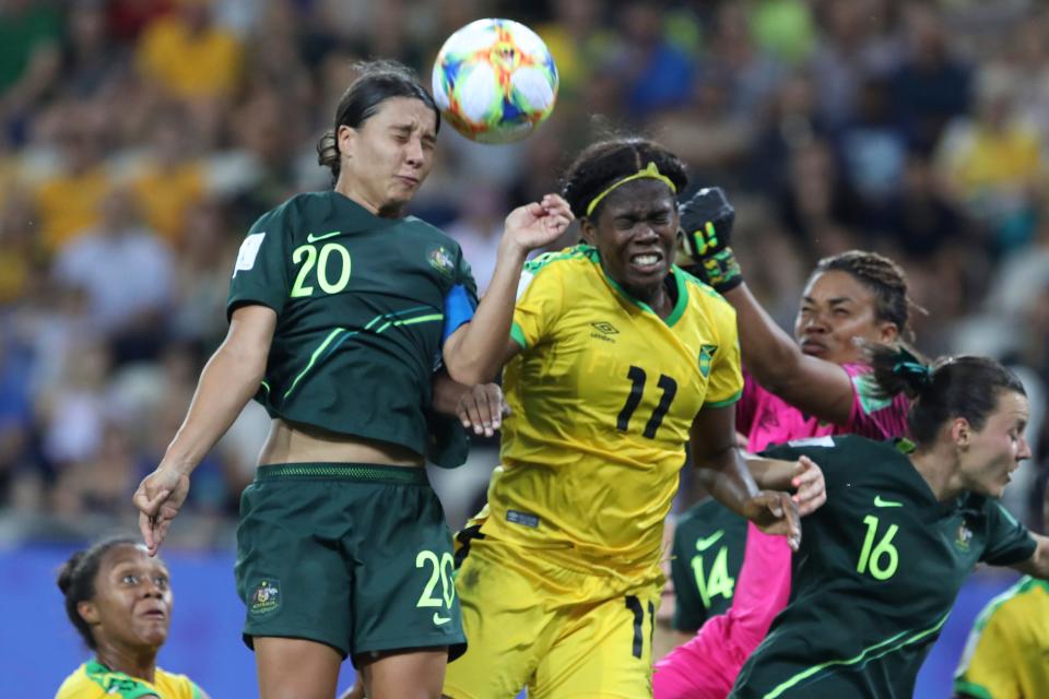 Australia&#39;s Sam Kerr, top left, jumps for the ball with Jamaica&#39;s Khadija Shaw, center, during the Women&#39;s World Cup Group C soccer match between Jamaica and Australia at Stade des Alpes stadium in Grenoble, France, Tuesday, June 18, 2019. (AP Photo/Laurent Cipriani)