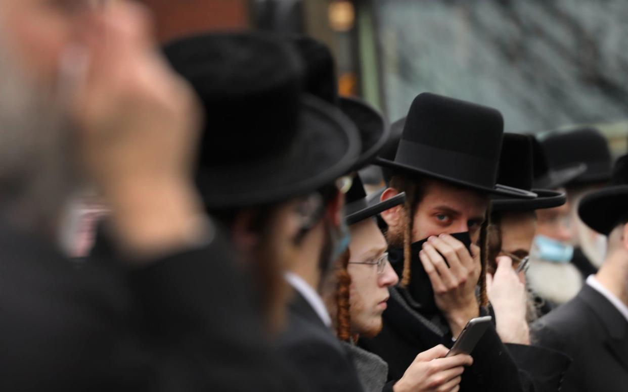 Hundreds of members of the Orthodox Jewish community attend the funeral for a rabbi who died from the coronavirus in the Borough Park neighbourhood on April 5 - GETTY IMAGES