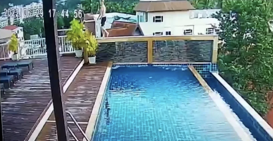 CCTV shows Australian tourist Joshua James Connell, 19, walking along a wall at the side of the swimming pool. Source: Australscope
