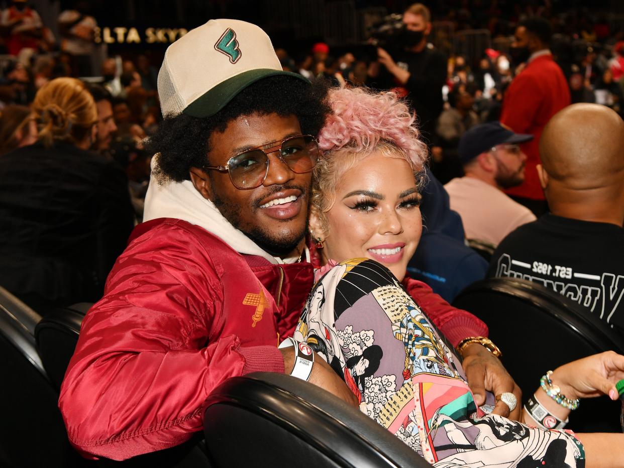 DC Young Fly and Jacky Oh attend the game between the Denver Nuggets and the Atlanta Hawks at State Farm Arena on December 17, 2021 in Atlanta, Georgia.