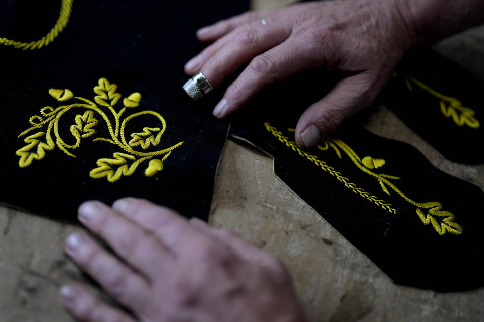 Saddler Klaus Bensmann works in his store in Bad Hindelang, Germany, Wednesday, Sept. 13, 2023. Bensmann produces tailored leather trousers and vests with hand embroidery. The leather comes from the alpine region and is tanned in Germany. For the upcoming Oktoberfest, many visitors like to wear the traditional dress. The 189th Oktoberfest, the world's biggest beer festival, runs from Sept. 16 through Oct. 3, 2023.(AP Photo/Matthias Schrader)