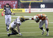 VANCOUVER, CANADA - NOVEMBER 27: Odell Willis #40 of the Winnipeg Blue Bombers draws a flag for this tackle on Travis Lulay #14 of the BC Lions during the CFL 99th Grey Cup November 27, 2011 at BC Place in Vancouver, British Columbia, Canada. (Photo by Jeff Vinnick/Getty Images)