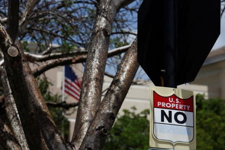 A "U.S. Property No Trespassing" sign is seen at ICE facilities as communities brace for a reported wave of ICE deportation raids in Miami