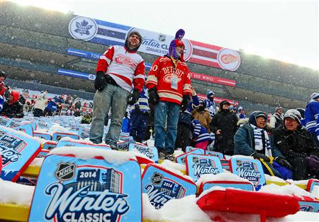 Detroit Red Wings fans in the stands prior to the 2014 Winter Classic hockey game between the Toronto Maple Leafs and Detroit Red Wings at Michigan Stadium. Mandatory Credit: Andrew Weber-USA TODAY Sports