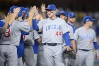 Oct 19, 2016; Los Angeles, CA, USA; Chicago Cubs first baseman Anthony Rizzo (44) celebrates with teammates after game four of the 2016 NLCS playoff baseball series against the Los Angeles Dodgers at Dodger Stadium. Mandatory Credit: Gary A. Vasquez-USA TODAY Sports