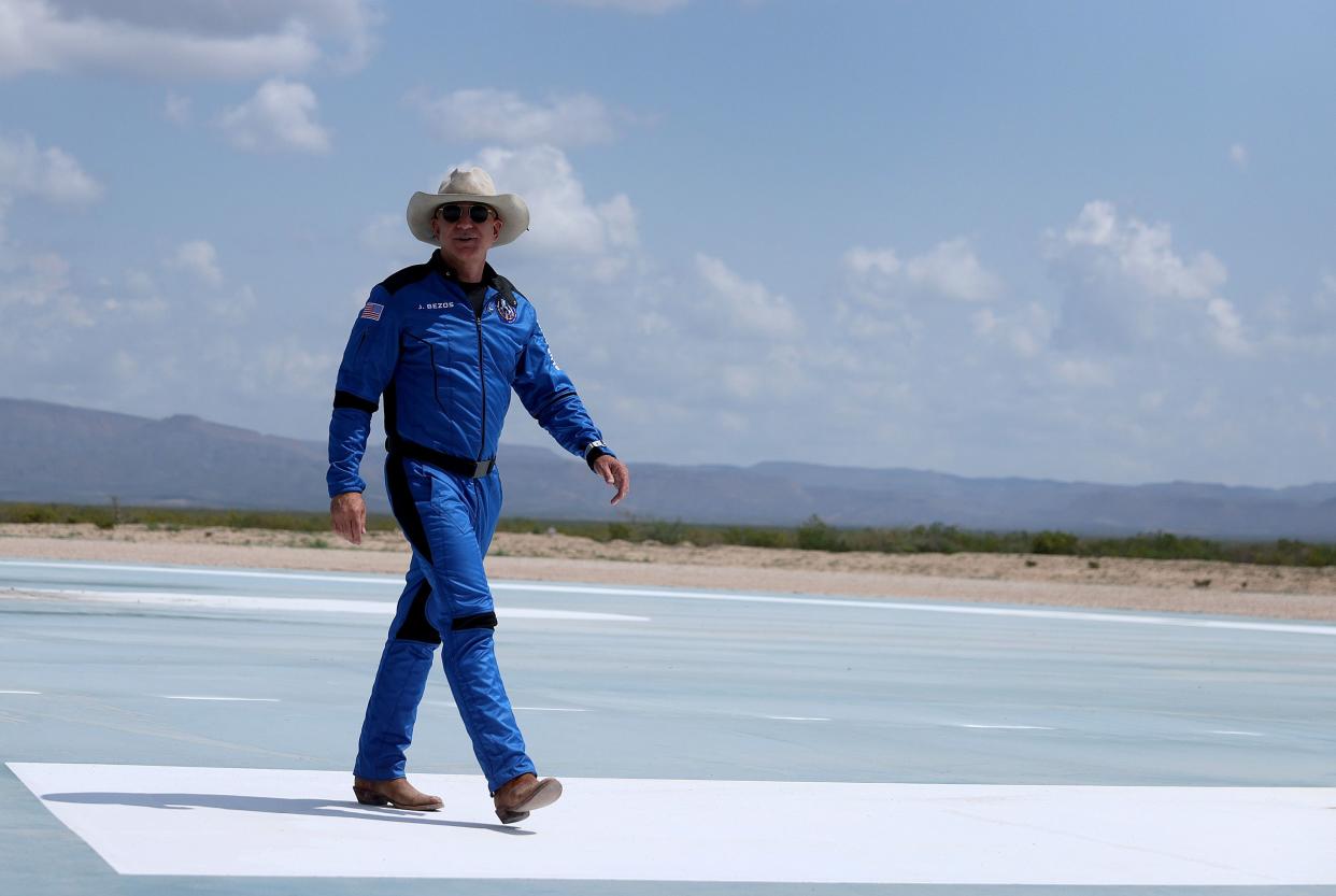 Jeff Bezos walks near Blue Origin’s New Shepard after flying into space on July 20, 2021 in Van Horn, Texas. Mr. Bezos and the crew that flew with him were the first human spaceflight for the company.