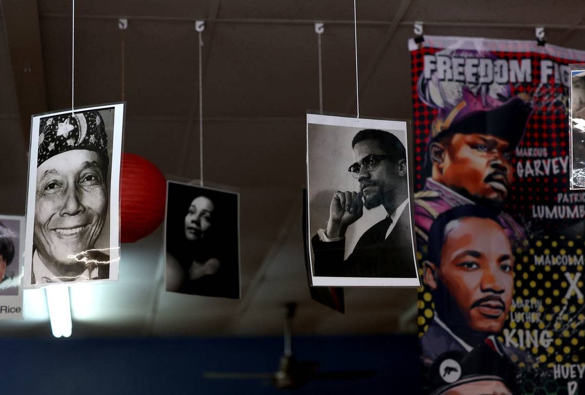 Portraits of historical Black figures hang from the ceiling of The Dock Bookshop on Friday, May 3, 2024. The book store is owned by sisters Donya and Donna Craddock and is the largest full-service Black-owned bookstores in Texas and the Southwest.