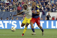 Columbus Crew forward Gyasi Zerdes (11) makes a play for the ball ahead of New England Revolution defender Andrew Farrell (2) during the first half of a MLS soccer match, Saturday, Sept. 18, 2021, in Foxborough, Mass. (AP Photo/Mary Schwalm)