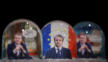 Snowglobes depicting French President Emmanuel Macron, made by Bruot company in eastern France, are displayed at a store in Paris, France, November 17, 2017. REUTERS/Christian Hartmann