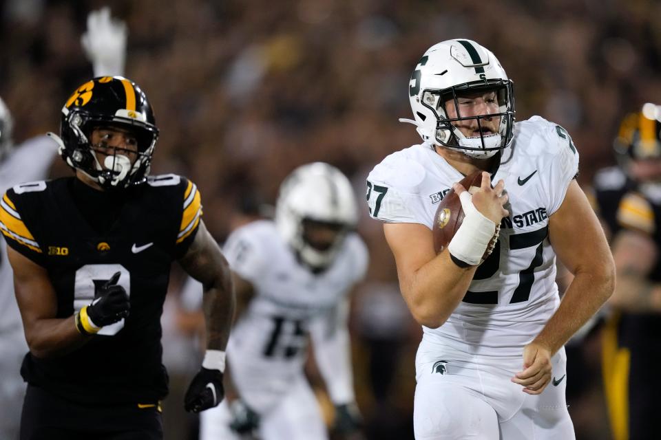 Michigan State linebacker Cal Haladay runs from Iowa wide receiver Diante Vines while returning a fumble 42 yards for a touchdown during the second half of MSU's 26-16 loss Saturday, Sept. 30, 2023, in Iowa City, Iowa.