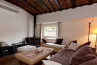 <p>There’s also a cozy den with a fireplace. <br> (Airbnb) </p>