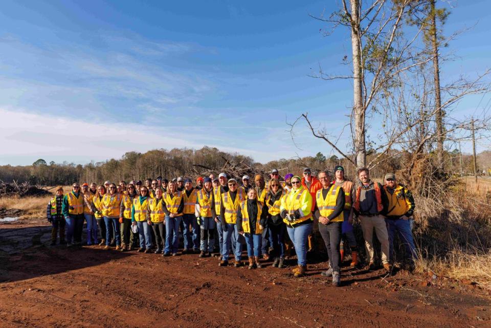 Rayonier employees gather for a group photo at their annual employee planting day.