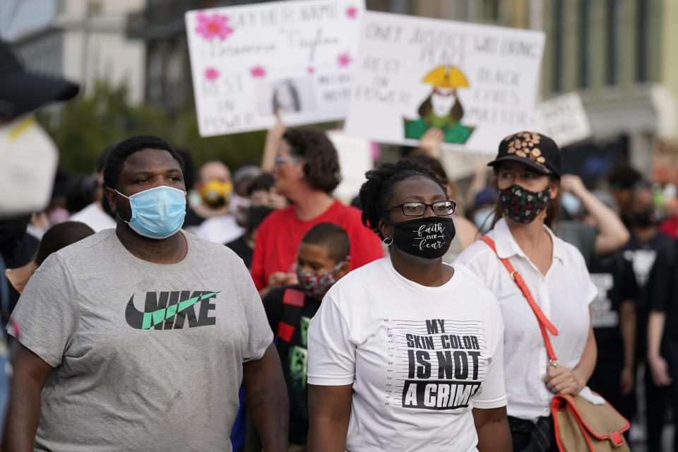 Black Lives Matter protesters march, Friday, Sept. 25, 2020, in Louisville. Breonna Taylor's family demanded Friday that Kentucky authorities release all body camera footage, police files and the transcripts of the grand jury hearings that led to no charges against police officers who killed the Black woman during a March drug raid at her apartment. (AP Photo/Darron Cummings)