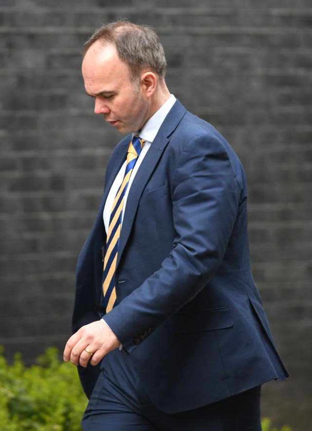 Gavin Barwell walks along Downing Street, London