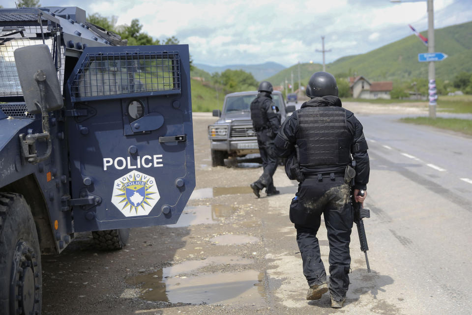 Kosovo police special unit members secure the area near the village of Cabra, north western Kosovo, during an ongoing police operation on Tuesday, May 28, 2019. A Kosovo police operation against organized crime in the north, where most of the ethnic Serb minority lives, has sparked tension, and Serbia ordered its troops to full alert. (AP Photo/Visar Kryeziu)