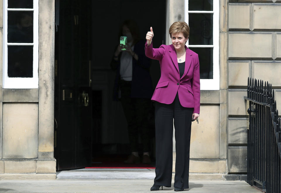 Scotland's First Minister and Scottish National Party leader Nicola Sturgeon poses for photographers, at Bute House in Edinburgh, Scotland. Sunday, May 9, 2021. British Prime Minister Boris Johnson has invited the leaders of the U.K.’s devolved nations for crisis talks on the union after Scotland’s pro-independence party won its fourth straight parliamentary election. Sturgeon said the election results proved a second independence vote for Scotland was “the will of the country." She said any London politician who stood in the way would be “picking a fight with the democratic wishes of the Scottish people.” (AP Photo/Scott Heppell)