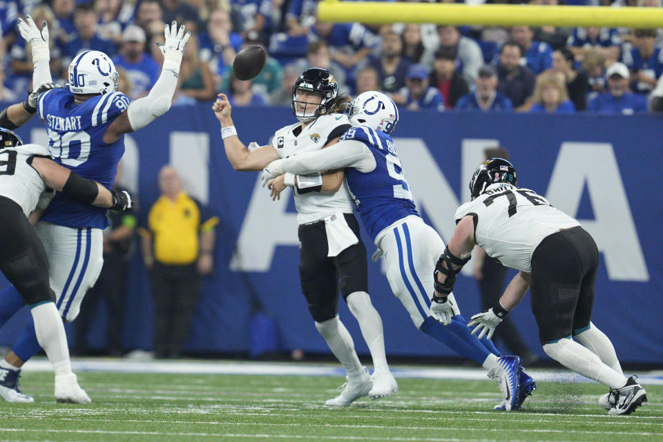 Jacksonville Jaguars quarterback Trevor Lawrence fumbles as he is hit by Indianapolis Colts defensive tackle DeForest Buckner (99) during the second half of an NFL football game Sunday, Sept. 10, 2023, in Indianapolis. Buckner recovered the fumble and ran it back for a touchdown. (AP Photo/Jeff Dean)