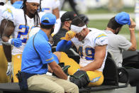 Los Angeles Chargers linebacker Drue Tranquill (49) is carted off the field during the first half of an NFL football game against the Cincinnati Bengals, Sunday, Sept. 13, 2020, in Cincinnati. (AP Photo/Aaron Doster)