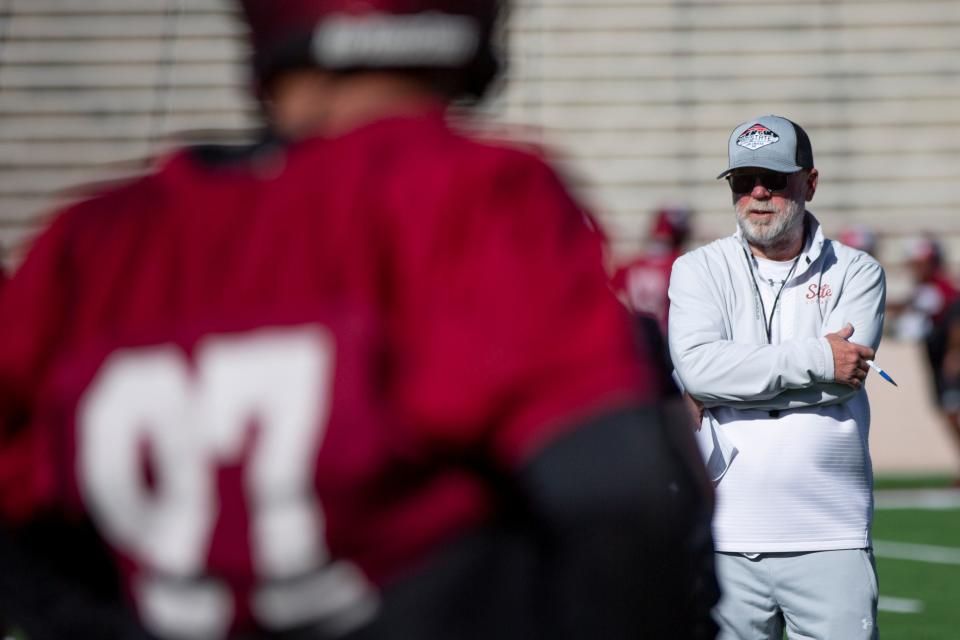 NMSU head coach Jerry Kill watches players run through drills during a NMSU football practice on Tuesday, March 21, 2023, at the Aggie Memorial Stadium. 