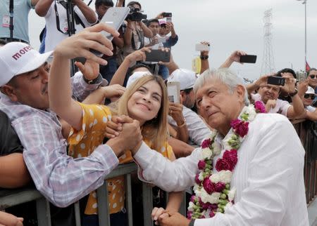 Mexican presidential candidate Andres Manuel Lopez Obrador greets supporters during a campaign rally, in Cancun, Mexico June 26, 2018. REUTERS/Israel Leal