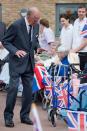 <p>The Duke of Edinburgh reaction after seeing a rollator walking frame while meeting residents of the St Michael’s Care Complex in Aylsham, Norfolk, during his official visit to the centre that provides care for the elderly. (Photo credit: Leon Neal | PA Archive/PA Images) </p>