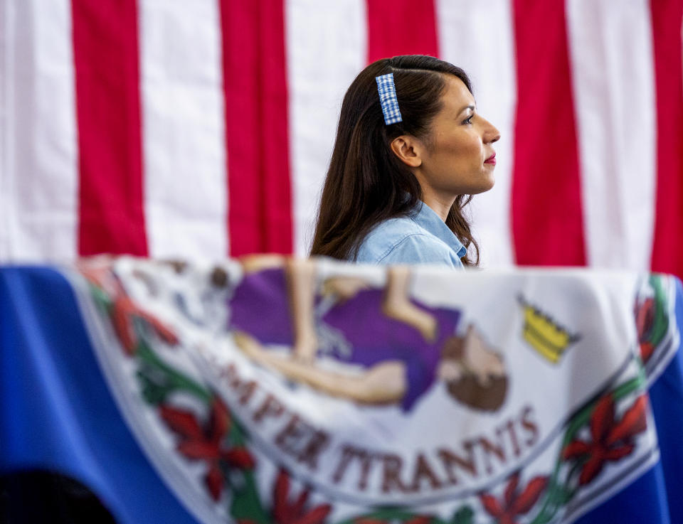 Yesli Vega, a Republican candidate for Virginia's 7th Congressional District, listens as Sen. Ted Cruz express his support for her at Crossroads Baptist Church in Spotsylvania, Va. on Monday, June 20, 2022. (Tristan Lorei/The Free Lance-Star via AP)