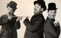 Sie bringen uns zum Lachen, zum Brüllen und manchmal auch zum Weinen: legendäre Leinwandkomiker wie Charlie Chaplin (links) sowie Laurel und Hardy. Wir stellen Ihnen die 25 Größten ihres Faches vor - von der Stummfilmzeit bis heute.