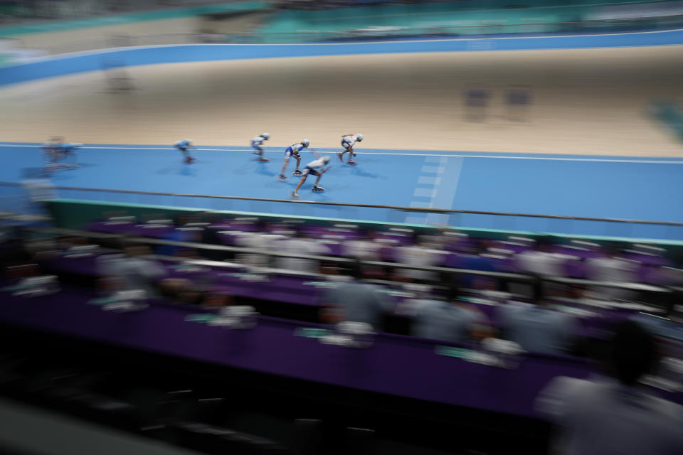 Athletes compete during the Women's Speed Skating 10000m Point-Elimination Race event of the 19th Asian Games in Hangzhou, China, Saturday, Sept. 30, 2023. (AP Photo/Aaron Favila)