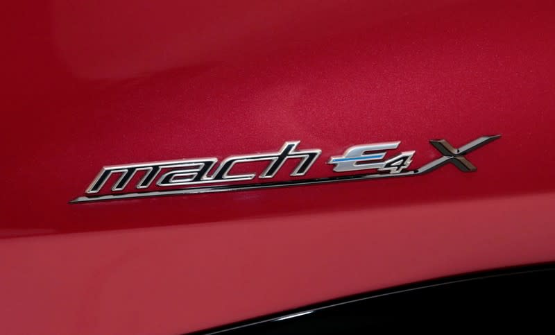 The name-plate is seen on Ford Motor Co's all-new electric Mustang Mach-E vehicle during a photo shoot at a studio in Warren, Michigan