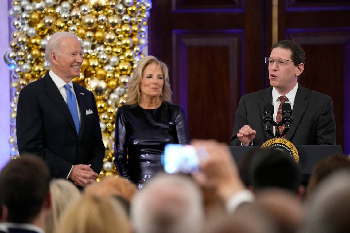 Rabbi Charlie Cytron-Walker speaks as President Joe Biden and first lady Jill Biden listen during a Hanukkah holiday reception in the Grand Foyer of the White House in Washington on Monday, Dec. 19, 2022.