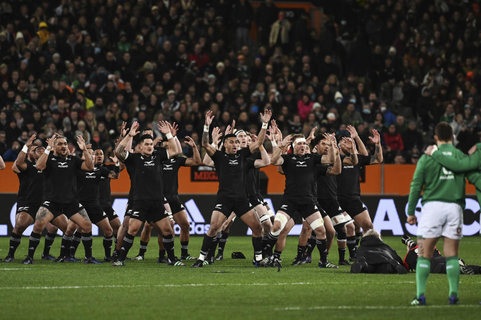 New Zealand All Blacks' players, left, perform the haka before their second rugby union international match against Ireland in Dunedin, New Zealand, Saturday, July 9, 2022. (Andrew Cornaga/Photosport via AP)