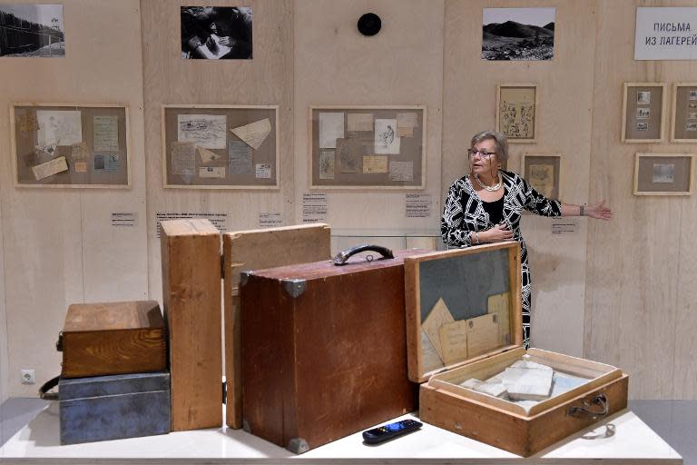 Curator Irina Ostrovskaya shows letters from Soviet leader Josef Stalin's political prisoners at 'The Right of Correspondence' exhibition, organized by historical and human-rights society Memorial, in Moscow, on January 19, 2015