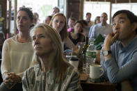 <p>People watch as former FBI director James Comey testifies during a Senate Intelligence Committee hearing, June 8, 2017, at the Building on Bond in the Brooklyn borough of New York. (Mary Altaffer/AP) </p>