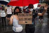 Protesters pray in the rain for a rally at Union Square, Friday, June 5, 2020, in the Manhattan borough of New York. Protests continued following the death of George Floyd, who died after being restrained by Minneapolis police officers on May 25. (AP Photo/John Minchillo)
