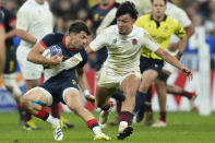 Argentina's Lautaro Bazan Velez, left, evades England's Marcus Smith during the Rugby World Cup third place match between England and Argentina at the Stade de France in Saint-Denis, outside Paris, Friday, Oct. 27, 2023. (AP Photo/Themba Hadebe)