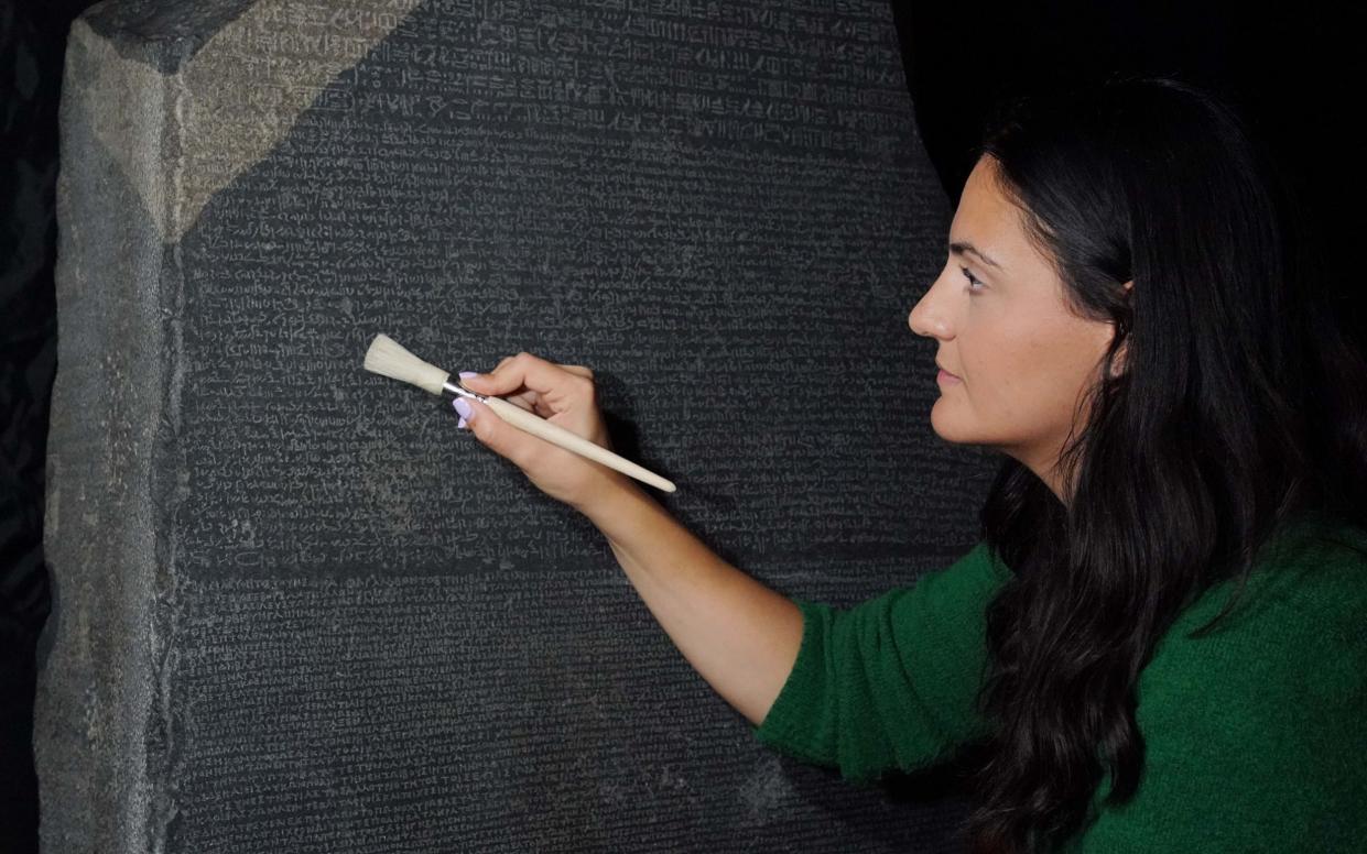Stephanie Vasiliou, a senior conservator, prepares the Rosetta Stone before it is moved - Jonathan Brady/PA
