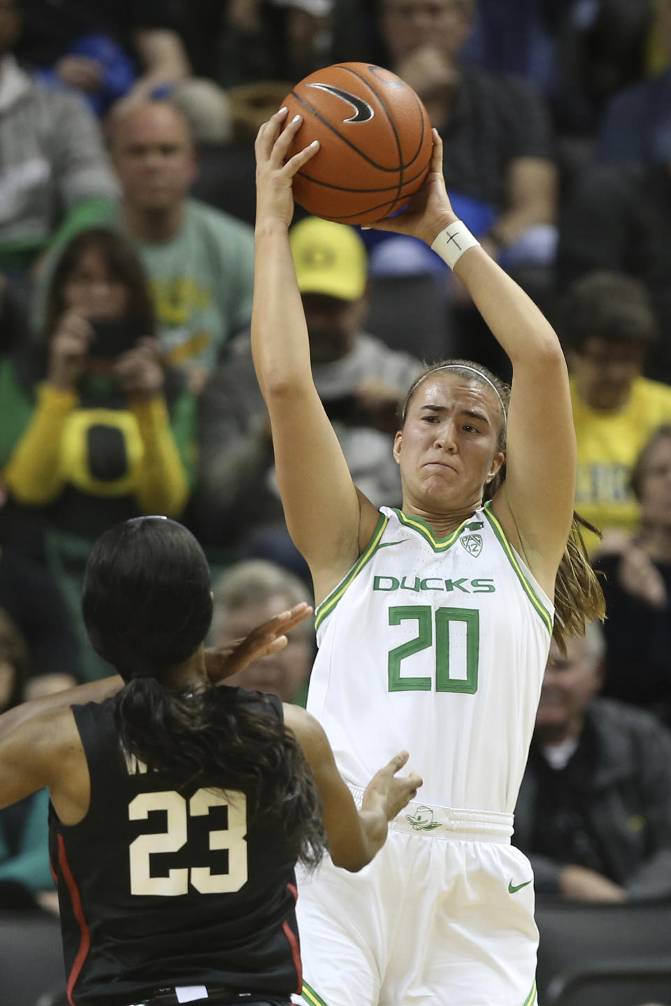 Oregon's Sabrina Ionescu, right, comes down with a rebound ahead of Stanford's Kiana Williams, left, during the third quarter of an NCAA college basketball game in Eugene, Ore., Thursday, Jan. 16, 2020. (AP Photo/Chris Pietsch)